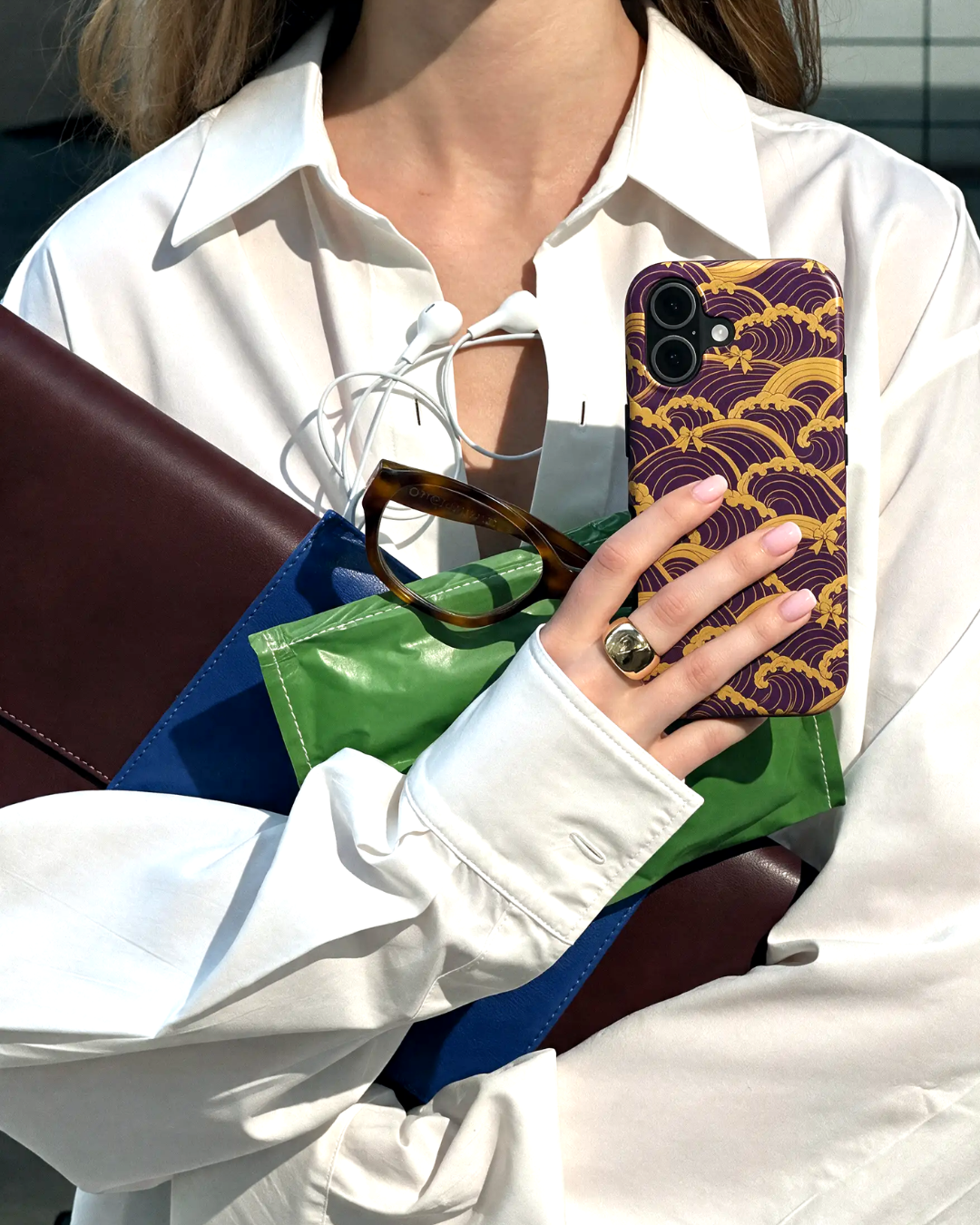 Model holding Hearth Weave phone case